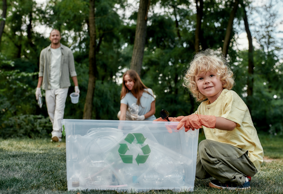 Young family gathering recyclable waste